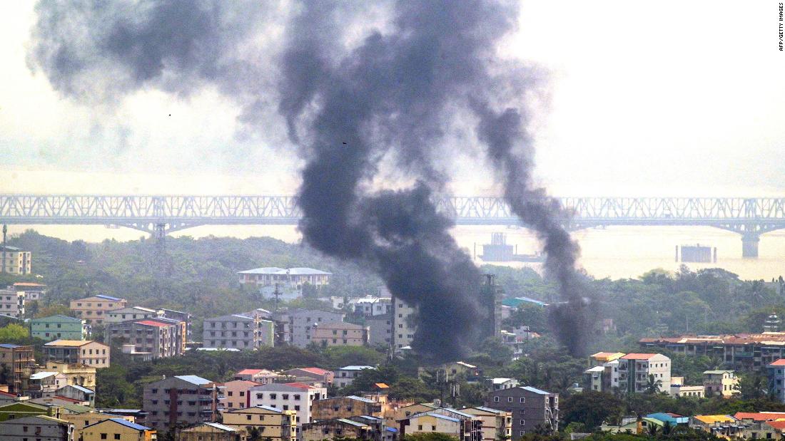 Smoke rises over Yangon&#39;s Thaketa Township on March 27.