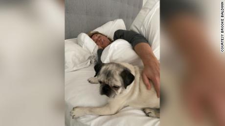 Brooke was stuck in bed because of Covid-19, fighting fevers, severe body aches and chills for 10 days. Her dog Pugsley often kept her company.