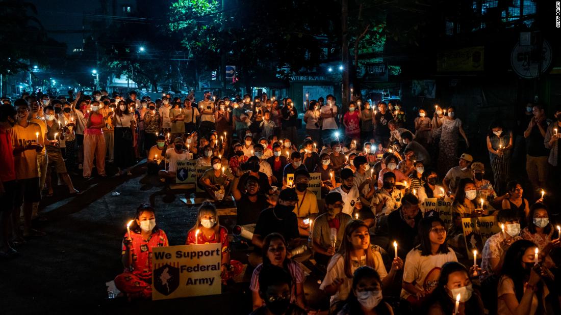Residents of the Tamwe area of Yangon participate in a candlelight vigil on April 3.