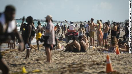 Lifeguard calls swimmers on a beach in the South Beach neighborhood in Florida on March 27.