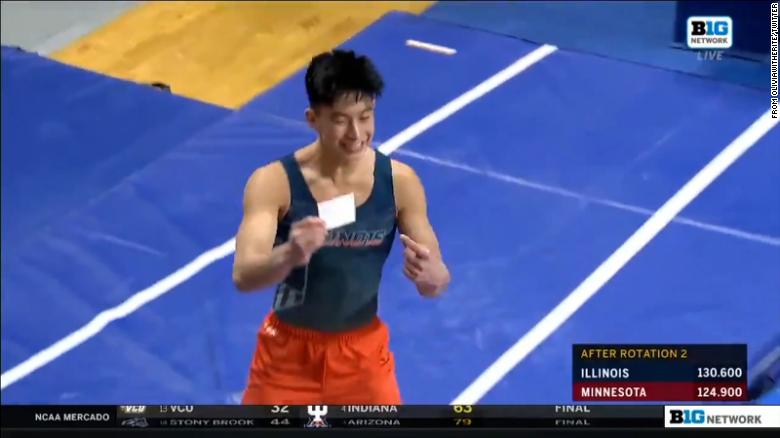 Illinois gymnast shows off Covid-19 vaccination card after sticking the landing