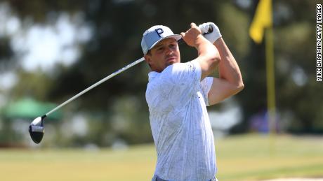 DeChambeau plays his shot from the third tee during a practice round prior to the Masters.