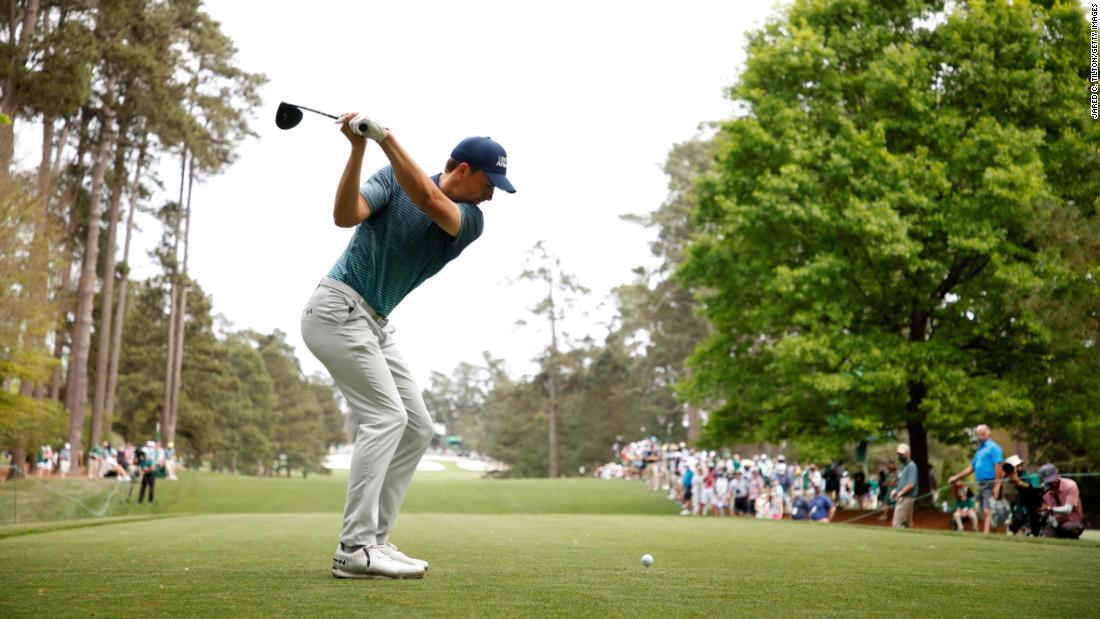 Spieth hits a tee shot on April 9.