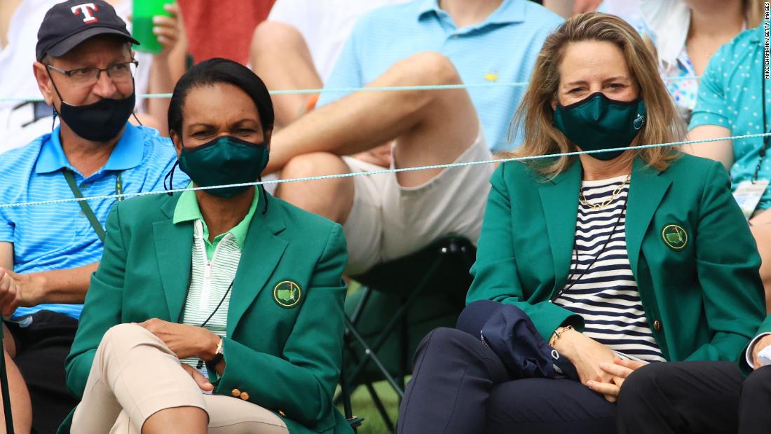 Former US Secretary of State Condoleezza Rice, left, watches the action along with fellow Augusta National member Heidi Ueberroth on April 9.