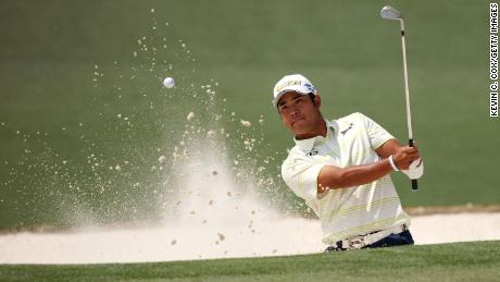 Matsuyama plays a shot from a bunker on the second hole in the final round of the Masters.