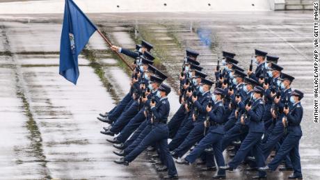 Police officers perform a new goose-stepping march, the same style used by police and troops on the Chinese mainland, at the city&#39;s police college during an open day to mark the National Security Education Day in Hong Kong on April 15, 2021.