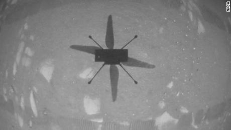 The helicopter&#39;s navigation camera captured a view of the Ingenuity&#39;s shadow on the Martian surface during its first flight.