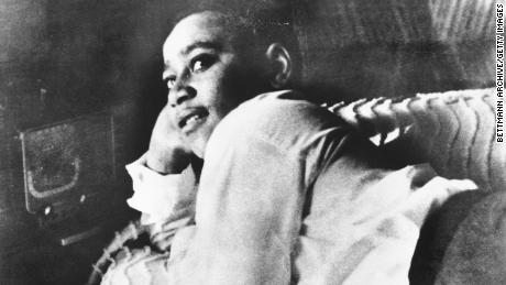 Emmett Till, shown lying on his bed, was lynched during a visit to rural Mississippi in 1955. 