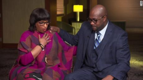Deborah Watts and Philonise Floyd  try to comfort each other while talking about their grief.