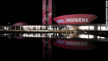 Members of the Articulation of Indigenous Peoples of Brazil (APIB), project the phrase &quot;Indigenous April&quot; at the National Congress in Brasilia during Indigenous Day, on April 19, 2021.