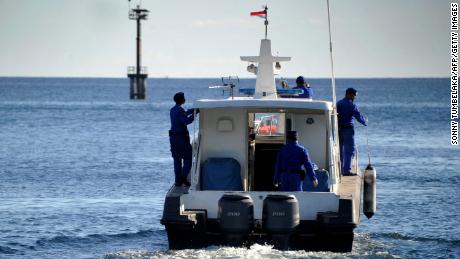 Indonesian marine police take part in the search operation for the missing naval KRI Nanggala-402 submarine on Thursday. 
