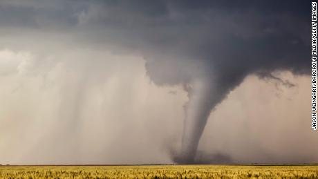 A stove pipe tornado cuts its way through a field in Minneola, Kansas, 24 May 2016.