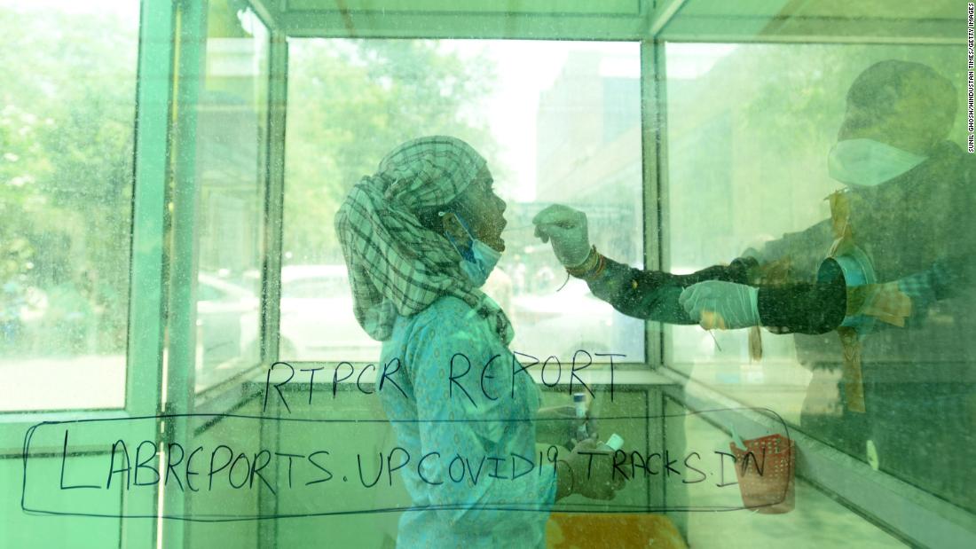 A health worker collects a Covid-19 test swab at a hospital in Noida on April 26.