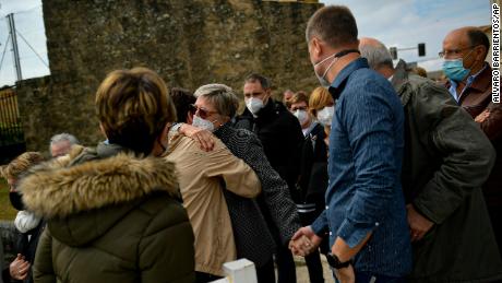 Angelines Amatraiain, center, David Beriain&#39;s mother, is hugged by a wellwisher, during a minute of silence in his birthplace of Artajona, northern Spain, on Wednesday. 