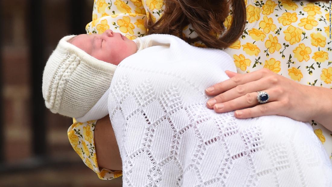 Catherine holds newborn Princess Charlotte while speaking to the media outside a London hospital in 2015.