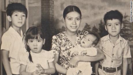 Long Trieu, Nina Trieu Tarnay, Tina Bui Trieu holding Quang Trieu, Mason Phuoc Trieu in 1976 in a photo taken while the author&#39;s father was imprisoned.