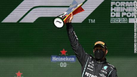 Hamilton celebrates on the podium after winning the Portuguese Grand Prix.
