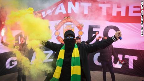 Fans are seen protesting Manchester United&#39;s Glazer ownership outside the stadium.