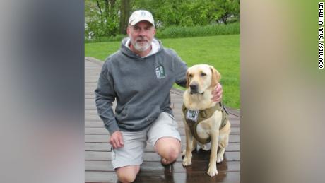 US Army vet Paul Whitmer, shown with his dog, Paul, now looks forward to going out in public.