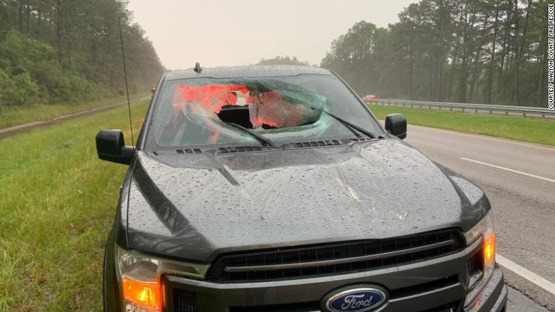 Chunk of highway goes flying through truck's windshield after lightning strikes road