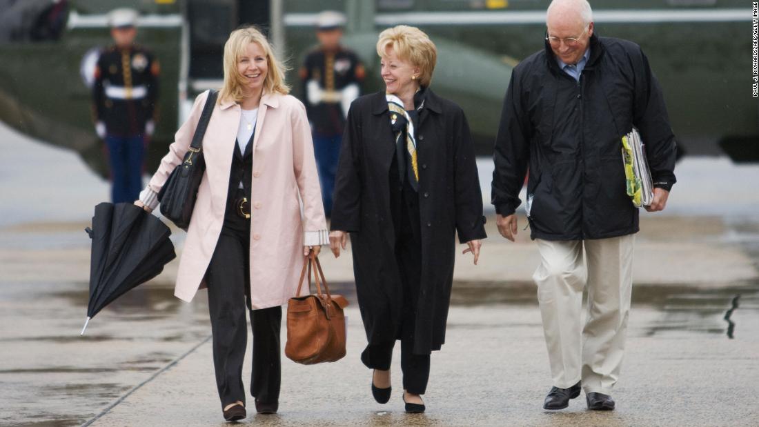 Cheney walks with her parents to Air Force Two as they prepare to leave for a 10-day trip to the Middle East in 2008.