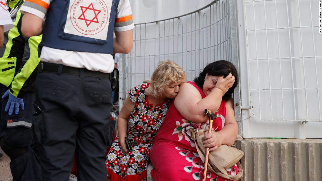 Israeli rescue teams help residents of an Ashkelon neighborhood on May 11.