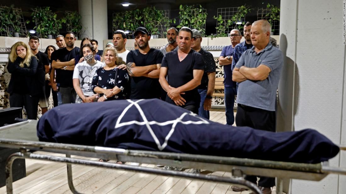 Mourners surround the body of Lea Yom Tov, an Israeli woman killed by a rocket attack from Gaza, during her funeral in Rishon LeZion, Israel, on Wednesday, May 12.