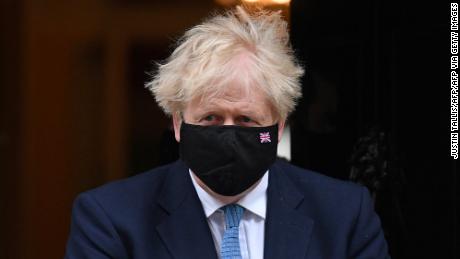 Prime Minister Boris Johnson, wearing a face mask to combat the spread of coronavirus, leaves 10 Downing Street on May 12, 2021.