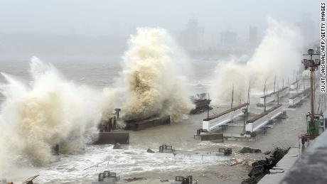Waves lash over onto a shoreline in Mumbai on May 17 as Cyclone Tauktae bears down on India.