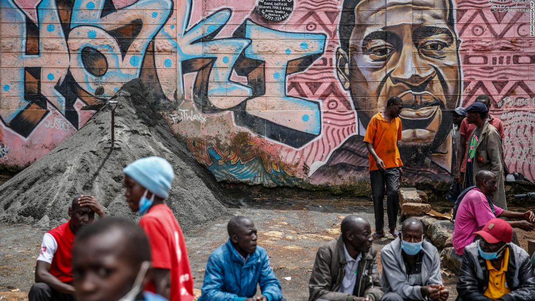 People in Nairobi, Kenya, sit near a Floyd mural on April 21. The Swahili word &quot;haki&quot; だからあなたがこの�quotを見ているという事実 &quot;justice.&quot;