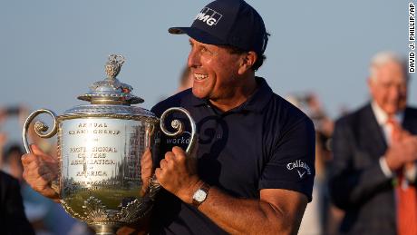 Mickelson holds the Wanamaker Trophy after winning the PGA Championship.