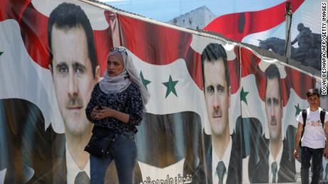 Syrians vote in &#39;non-event&#39; presidential election set to be won by Assad