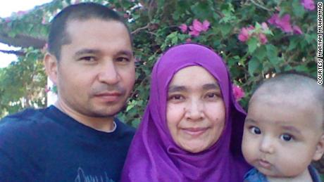 Maryam Muhammad, her child and her husband, Muhtar Rozi, who disappeared during a crackdown on Uyghur Muslims in Egypt. 