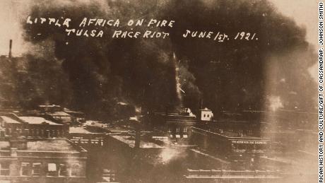 The Greenwood District burns during the mob violence on June 1, 1921. 