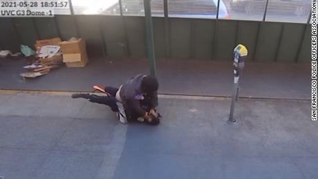 Bystanders helped a San Francisco police officer as she was being attacked