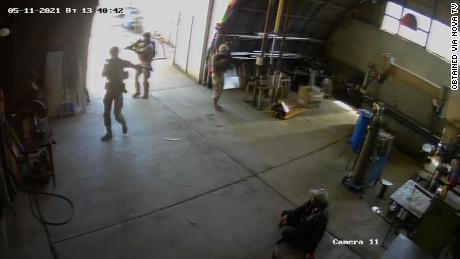 Video from the factory&#39;s security cameras obtained by CNN affiliate Nova TV appears to show US troops in military gear holding guns and walking in and out of the factory as others look on.