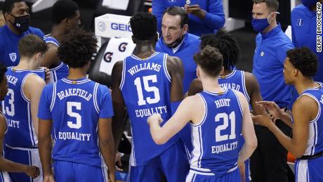 Duke head coach Mike Krzyzewski, top, talks to his team during the first half of an NCAA college basketball game against Louisville on Wednesday, March 10, 2021. 