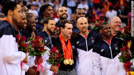 The USA basketball team poses with coach Mike Krzyzewski (center) after the mens basketball gold medal game against Spain at the Beijing Olympic Basketball Gymnasium during the 2008 Beijing Olympic Games.  