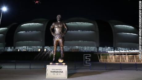 A 16-foot-5-inch tall statue of late football legend Diego Maradona is unveiled at the Estadio Unico Madre de Ciudades.