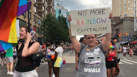A marcher calls out rainbow capitalism during a NYC Pride event in 2019. 