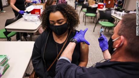 Latiah Haley receives a dose of the Johnson &amp; Johnson vaccine at an event organized by the fire department in Thornton, Colorado, on March 6, 2021.
