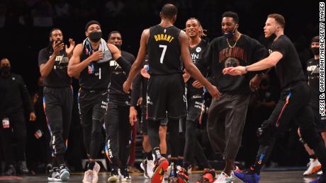 Durant and his teammates celebrate during the game against the Bucks.