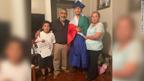 Recent graduate Ever Lopez with his family.