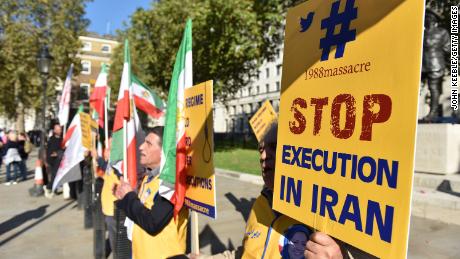 People protest against Iran&#39;s death penalty opposite Downing Street as a march to demand a people&#39;s vote against Brexit passes by on October 2018 in London, England. 
