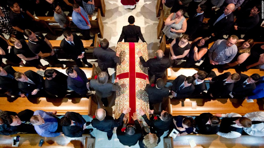 The casket of Pulse victim Christopher Andrew Leinonen enters the Cathedral Church of St. Luke for his funeral service on June 18, 2016.