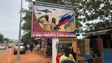 A billboard with Russian propaganda is seen in Bangui. The message reads: &quot;Russia hand in hand with the Central African Republic, talk a little, work a lot.&quot;