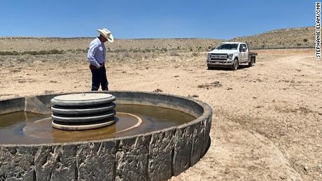 Cattle Rancher T.J. Atkin checks on one of his troughs which provide drinking water for his cows.