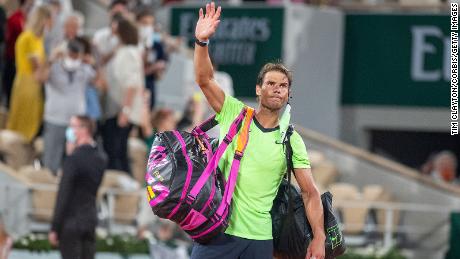 Rafael Nadal waves to the crowd after his French Open semifinal defeat to Novak Djokovic.