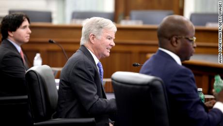 NCAA president Mark Emmert, center, speaks during a Senate  committee hearing on NCAA name, image, and likeness rights on June 9, 2021, in Washington.