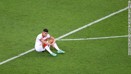 Mert Muldur looks dejected following the defeat to Switzerland.